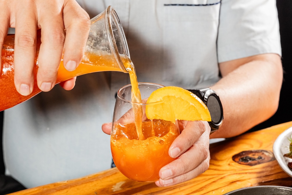 image of a man pouring a drink