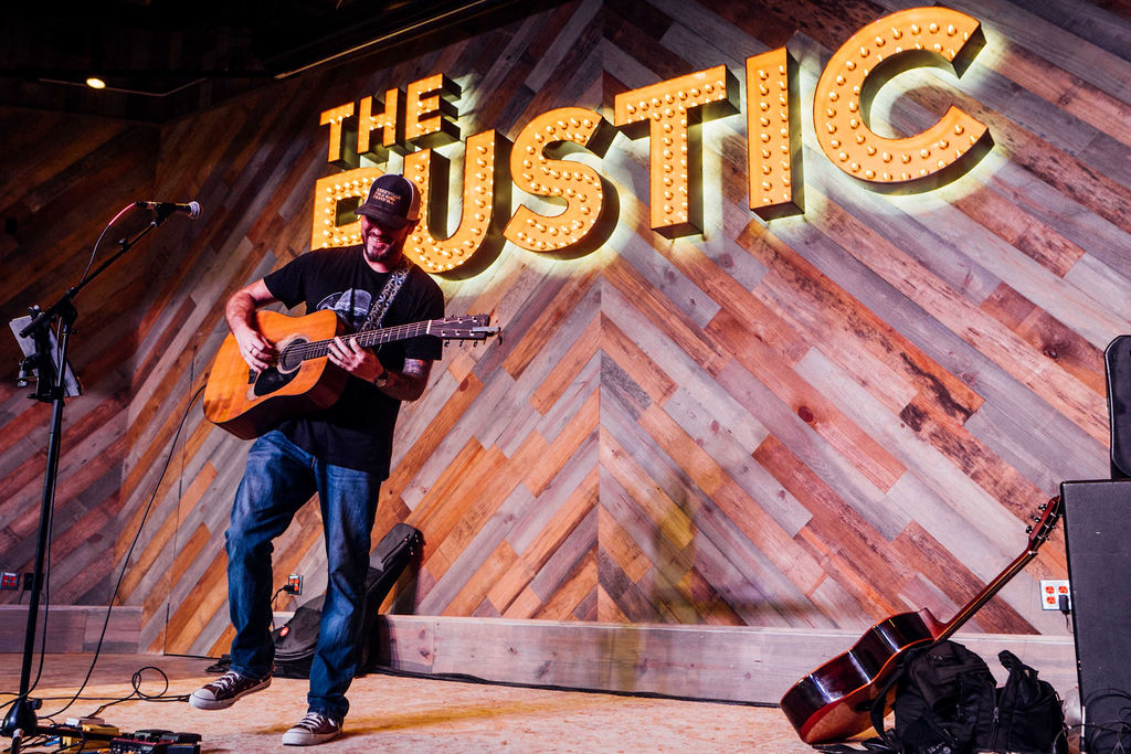 Men playing guitar at the Rustic