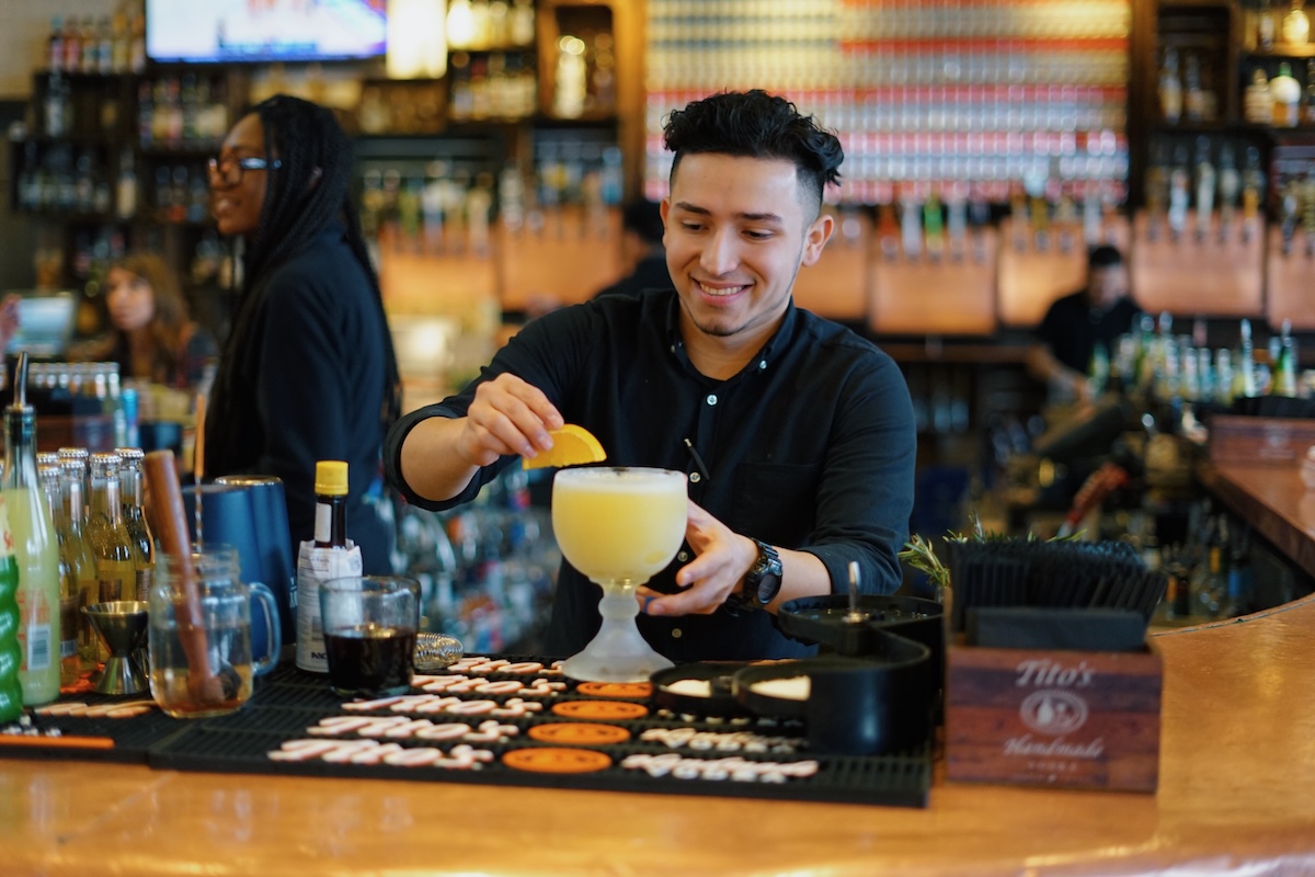 Boy serving drink at The Rustic private party