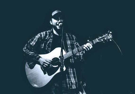 Men playing guitar and singing